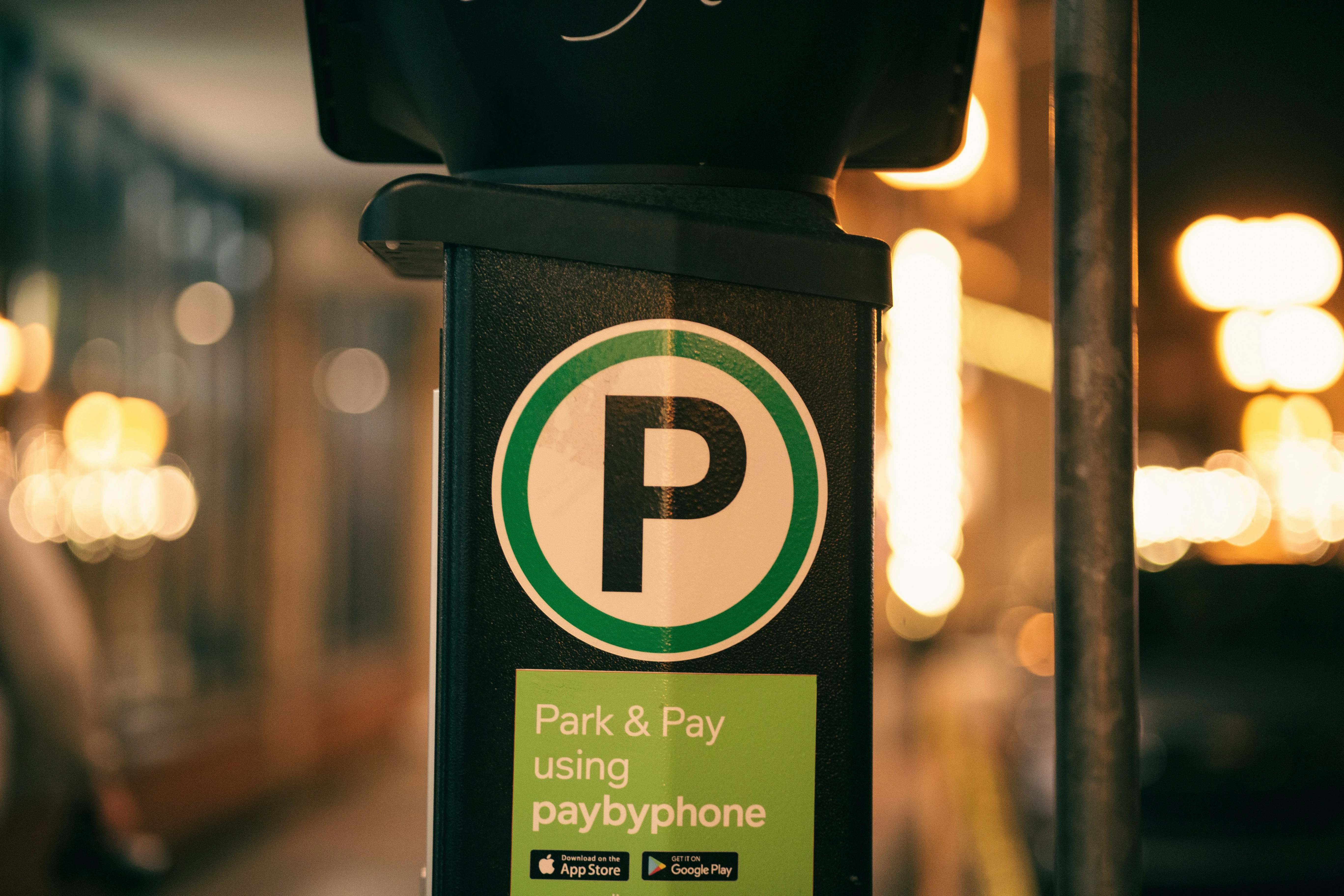 Smartphone showing a parking app in a Flemish city centre